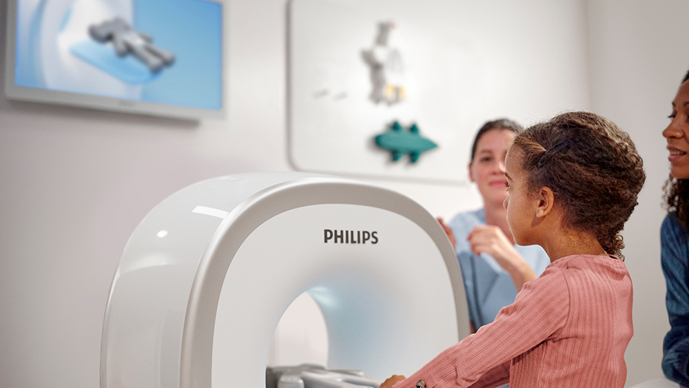Download image (.jpg) (opens in a new window) Two doctors reviewing mammogram case